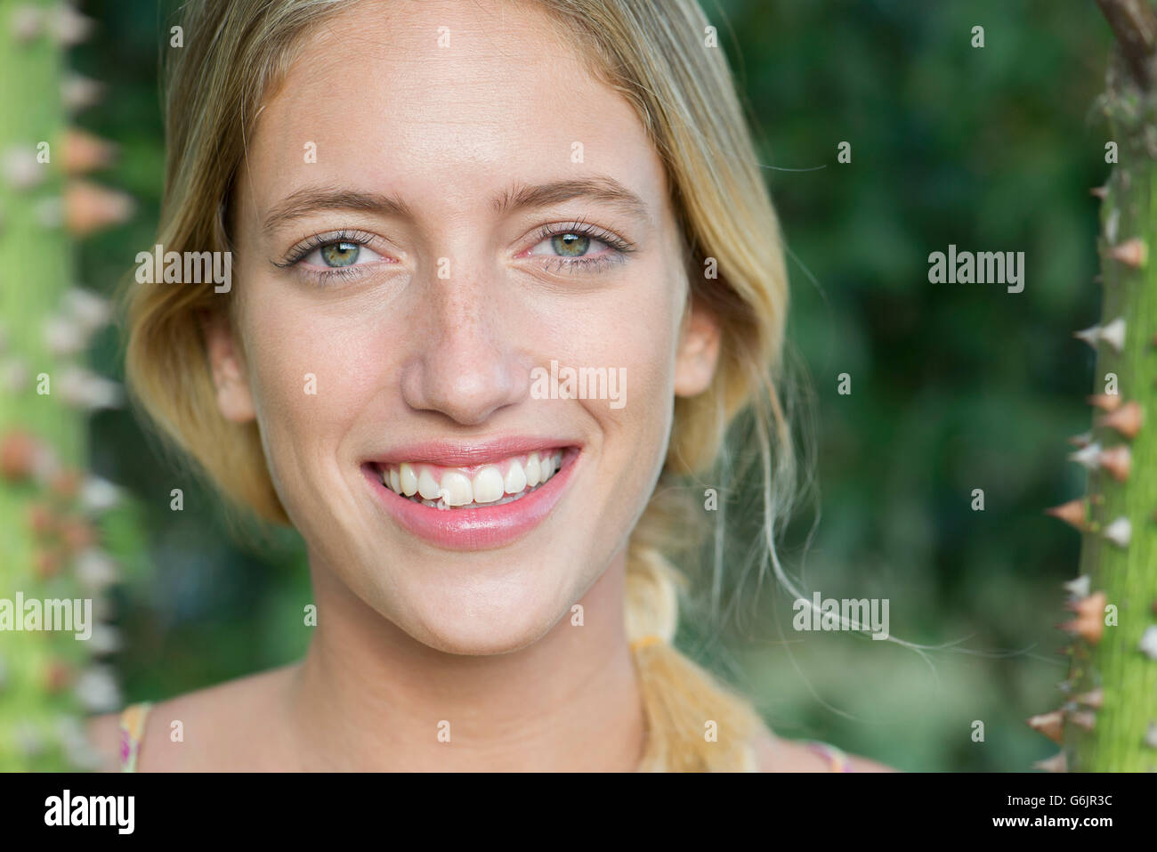 Young woman smiling cheerfully, portrait Stock Photo
