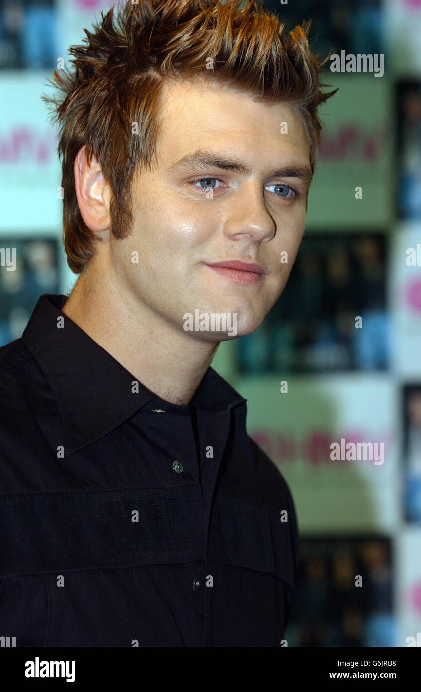 Singer Bryan McFadden from the Irish boyband Westlife during a photocall and record signing to launch their new single 'Mandy', which is released at HMV Trocadero, Piccadilly Circus, central London. * Mandy was originally a hit for Barry Manilow back in 1975. Stock Photo