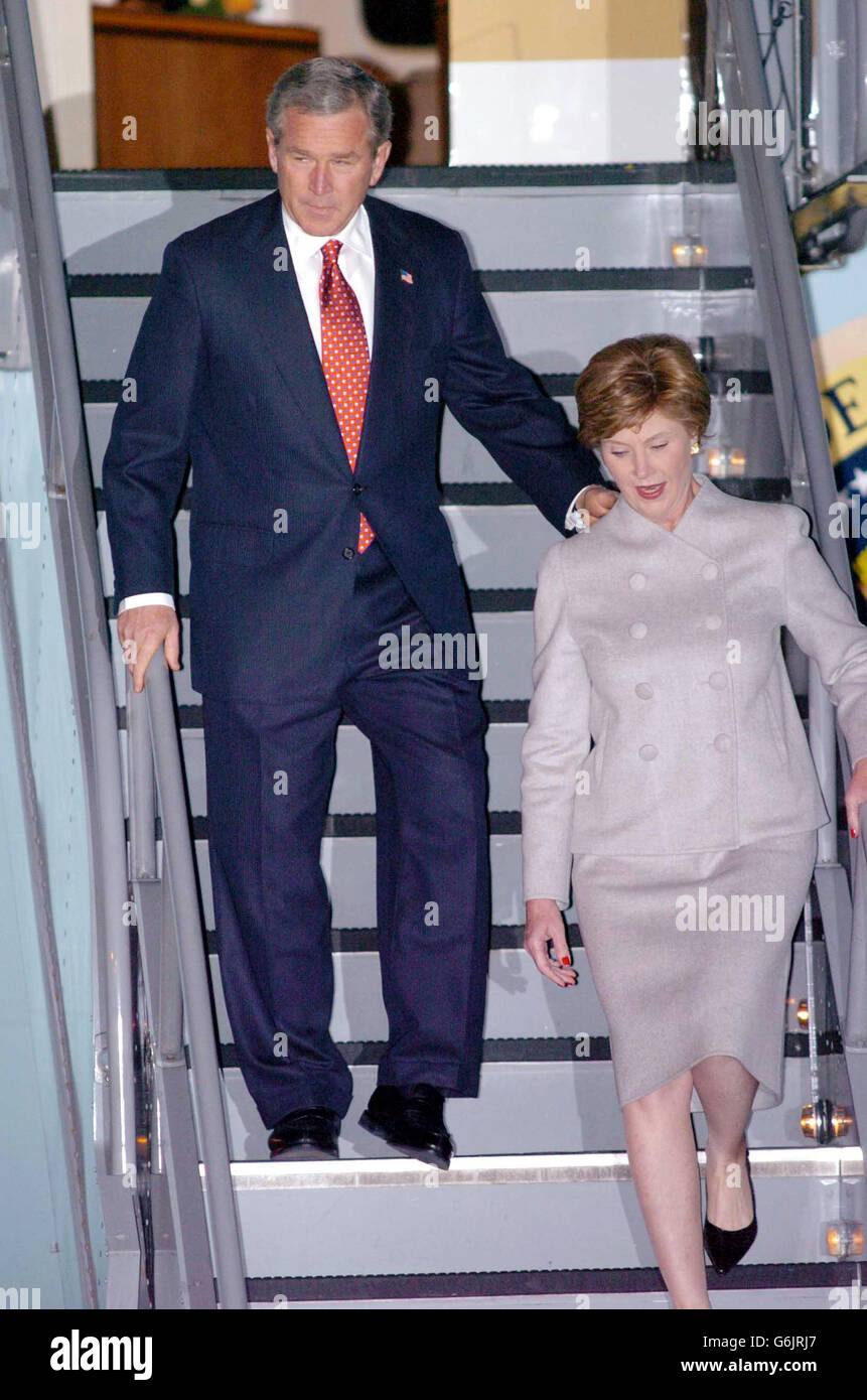 US President George Bush with his wife Laura arrive at London's Heathrow Airport, for their four-day state visit to the U.K. Mr Bush is the first American President to be accorded the honour of a full state visit. 19/11/03: US President George Bush with his wife Laura arriving at London's Heathrow Airport, for their four-day state visit to the U.K. US President George W Bush was expected to meet relatives of British victims of the September 11th terrorist atrocity. Mr Bush was expected to hold a private meeting with some of the families of loved ones who lost their lives in the attacks, Stock Photo
