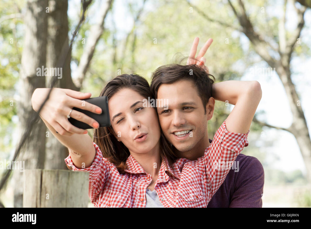 Happy Couple Wearing Beige Hoodie · Free Stock Photo