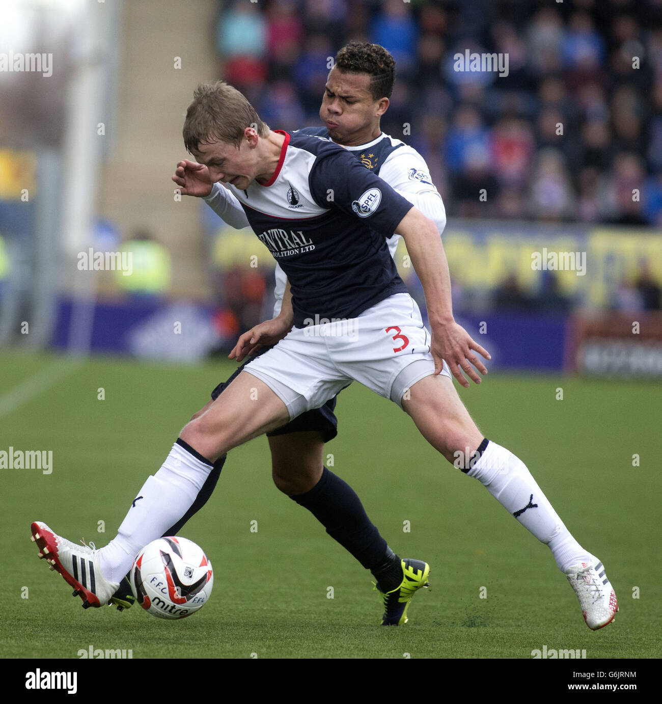 Rangers' Arnold Peralta and Falkirk's Stephen Kingslay (front) during the Fourth Round William Hill Scottish Cup match at Falkirk Stadium, Falkirk. Stock Photo
