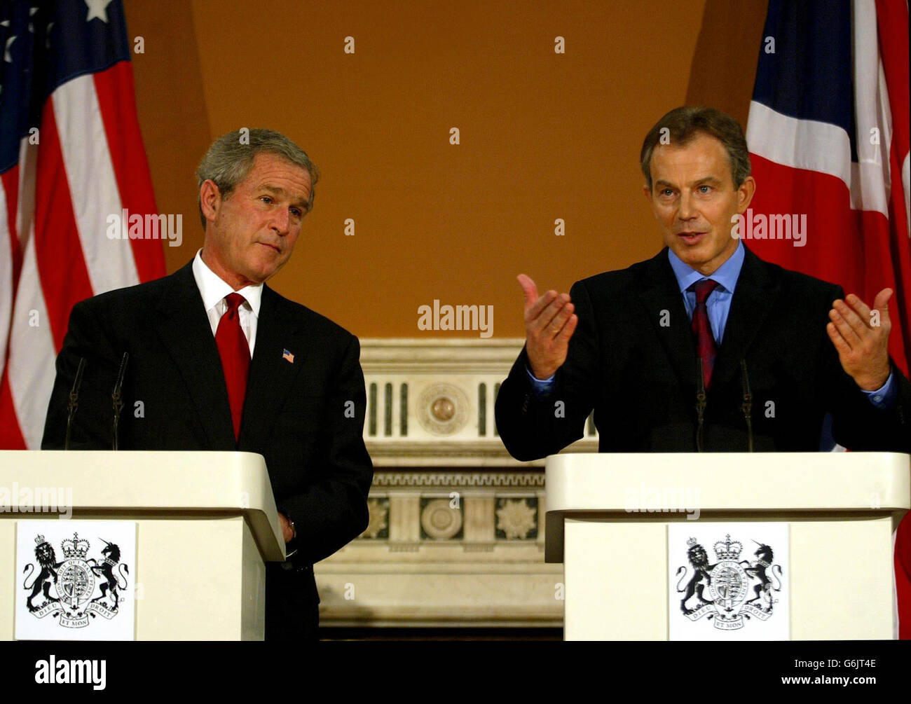 British Prime Minister Tony Blair (R) alongside US President George Bush speaking during a joint press conference at the Foreign Office in London. Stock Photo