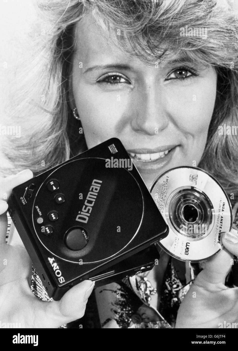 A model holds the new Sony Pocket Discman, which plays mini-compact discs, as well as standard discs. Stock Photo