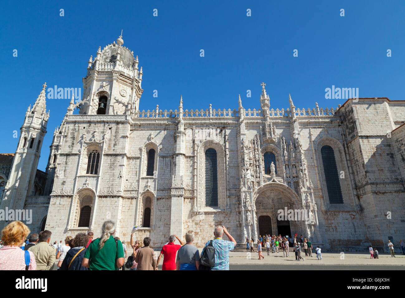 Tourists at the Jeronimos Monastery in Belem, Lisbon. The monastery is an example of Portuguese Gothic Maunueline style of archi Stock Photo