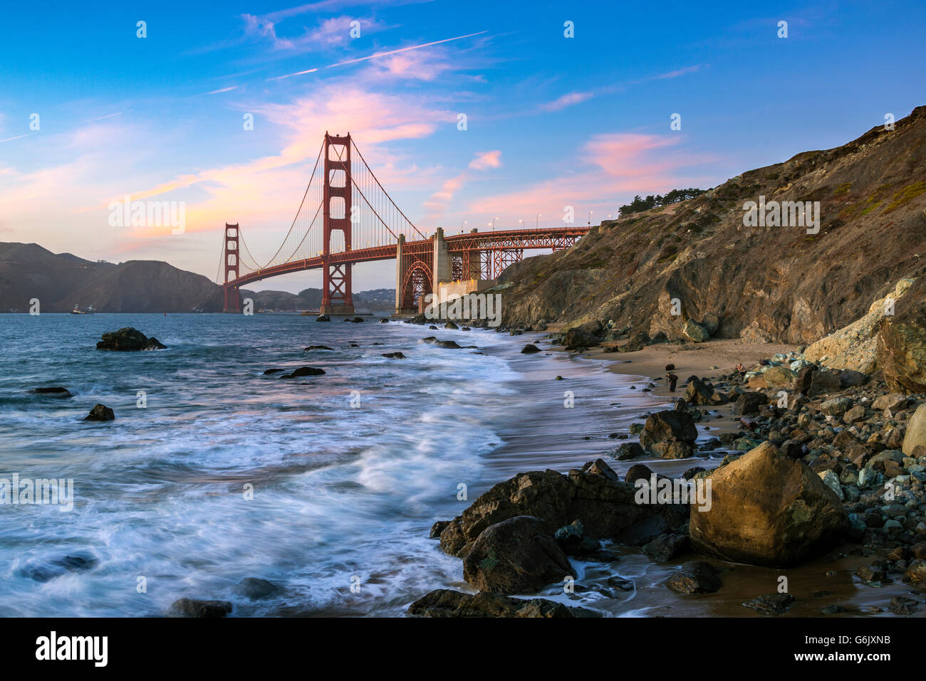 Dusk at Golden Gate Bridge, Marshall's Beach, rocky coast, San Francisco, USA, North America Stock Photo