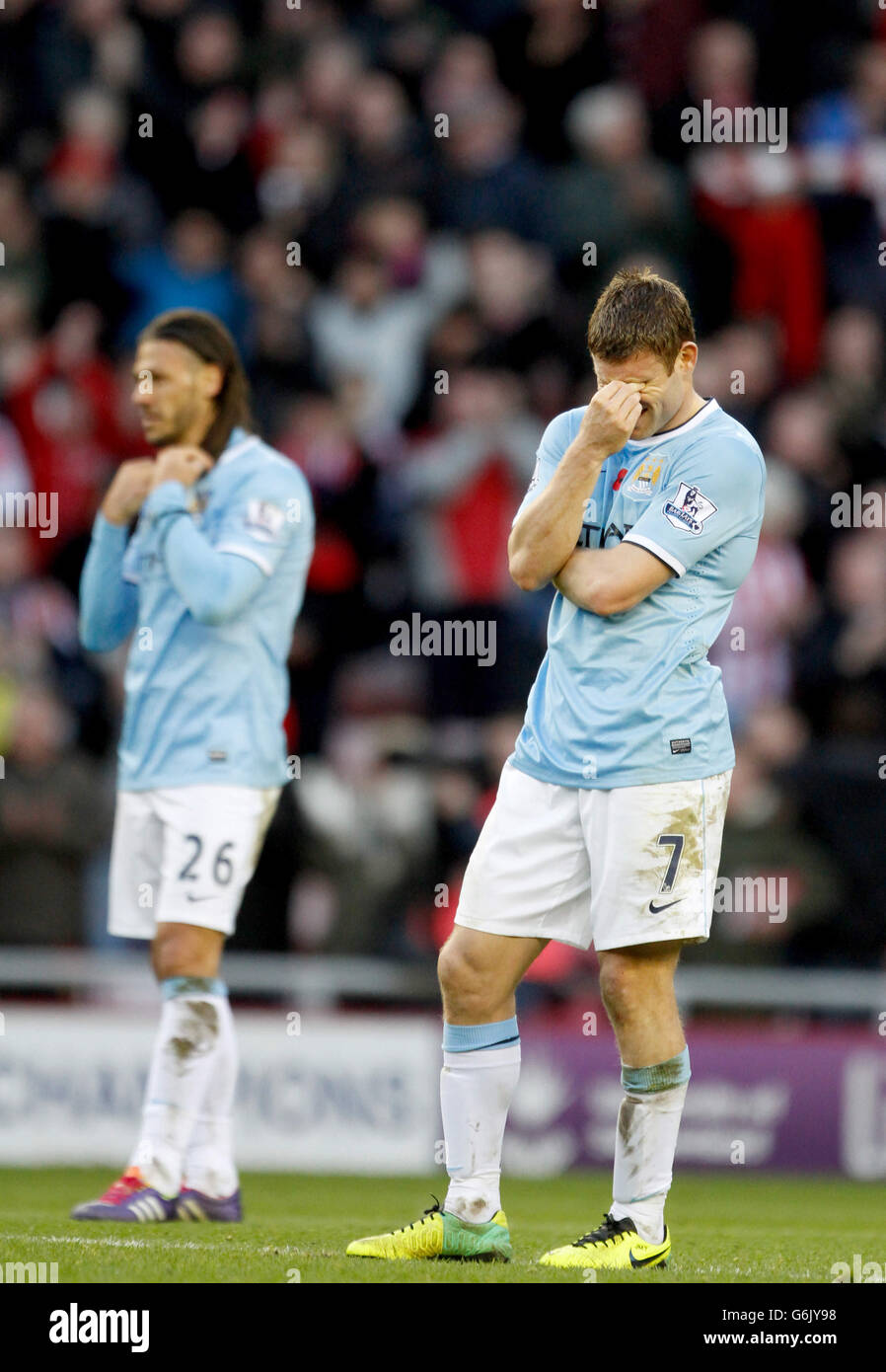 Soccer - Barclays Premier League - Sunderland v Manchester City - Stadium of Light. Manchester City's James Milner (right) and Martin Demichelis dejected after the final whistle Stock Photo