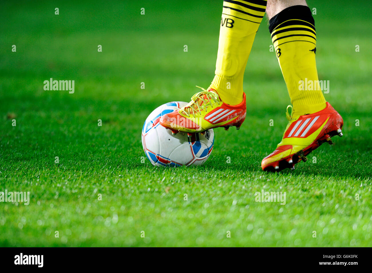 Legs and Adidas shoes of a Dortmund player with the league ball,  preparatory match for the second round of the tournament season Stock Photo  - Alamy
