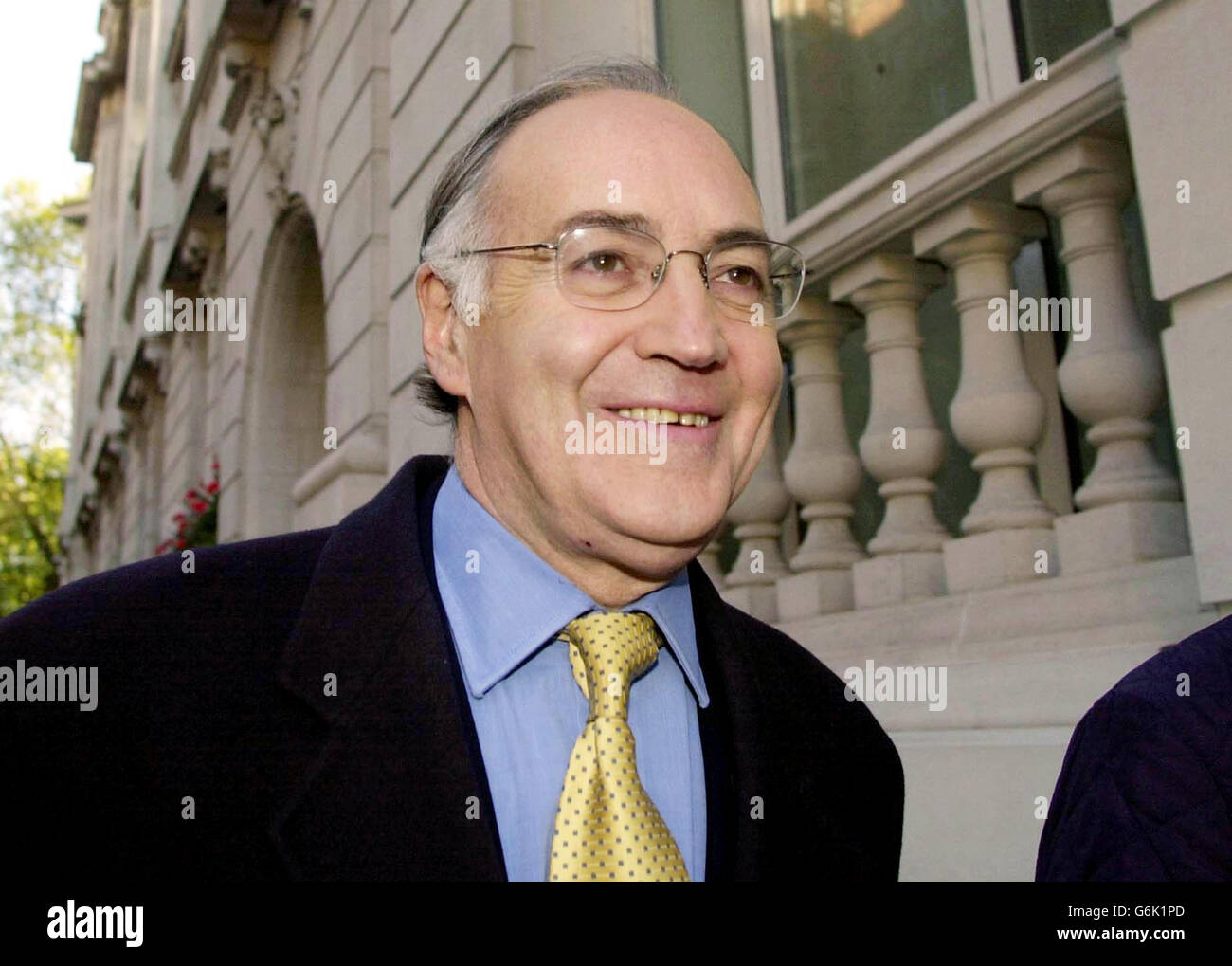 Shadow chancellor michael howard leaving from television studios in