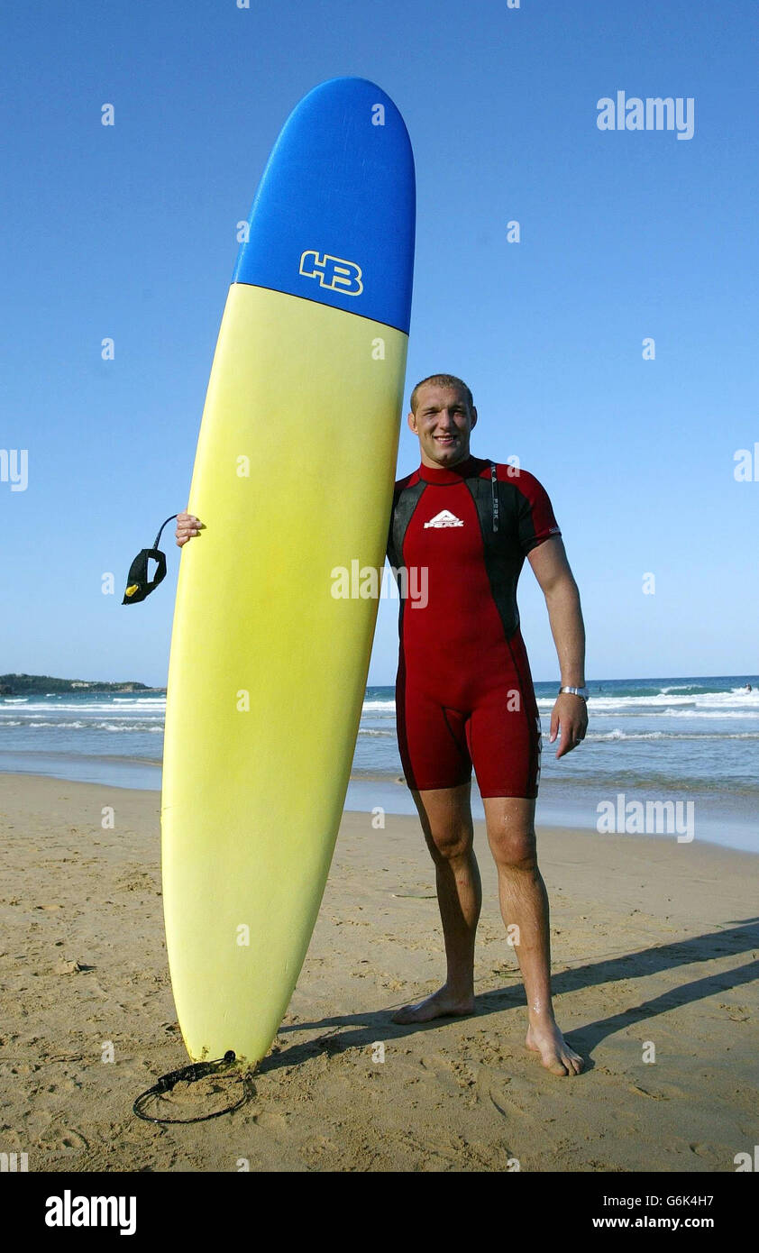 England's Ben Kay poses with his surf board at Manly Beach in Australia, ahead of their Rugby World Cup semi-final match against France on Sunday. NO MOBILE PHONE USE. INTERNET SITES MAY ONLY USE ONE IMAGE EVERY FIVE MINUTES DURING THE MATCH Stock Photo