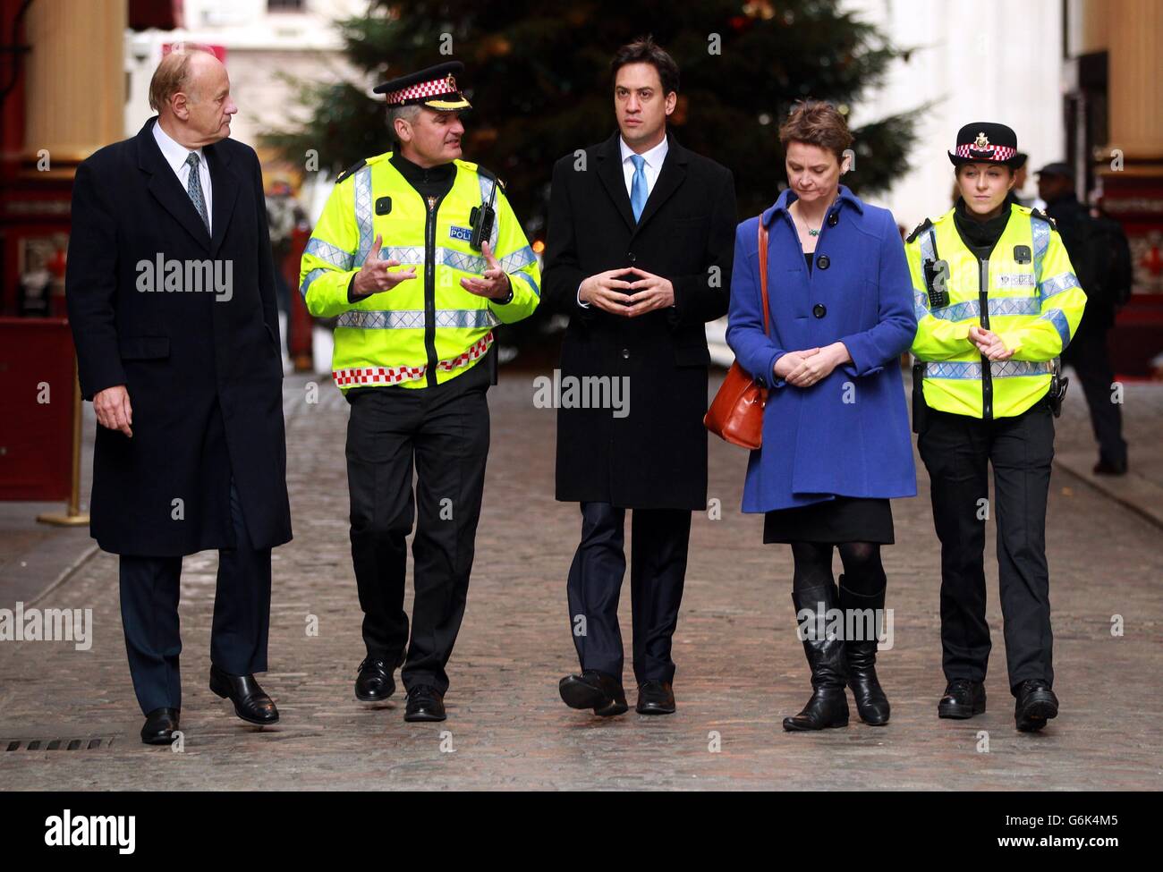 Previously unissued photo dated 22/11/13 of (left to right) Lord Stevens, Superintendent David Laws, Labour Leader Ed Miliband, Shadow home secretary Yvette Cooper and Inspector Claire Burgess meeting in the City of London to discuss neighbourhood policing. Stock Photo