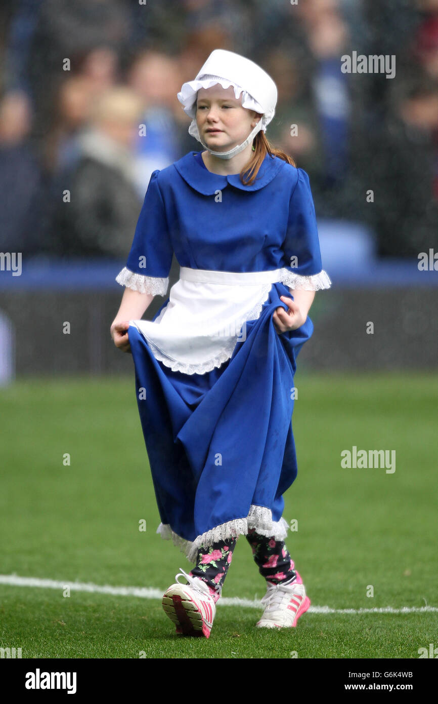 An Everton Toffee Girl on the pitch in the build up to the match Stock