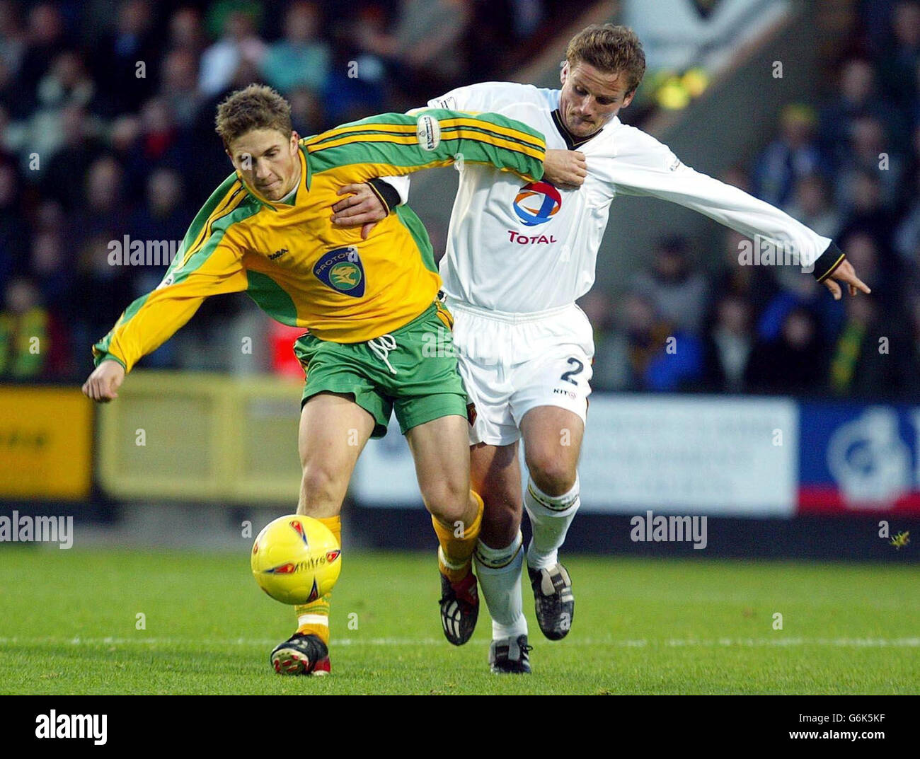 Paul McVeigh of Norwich (left) fights off Watford's Neal Ardley, during the Nationwide Division One match at Carrow Road, Norwich, NO UNOFFICIAL CLUB WEBSITE USE. Stock Photo