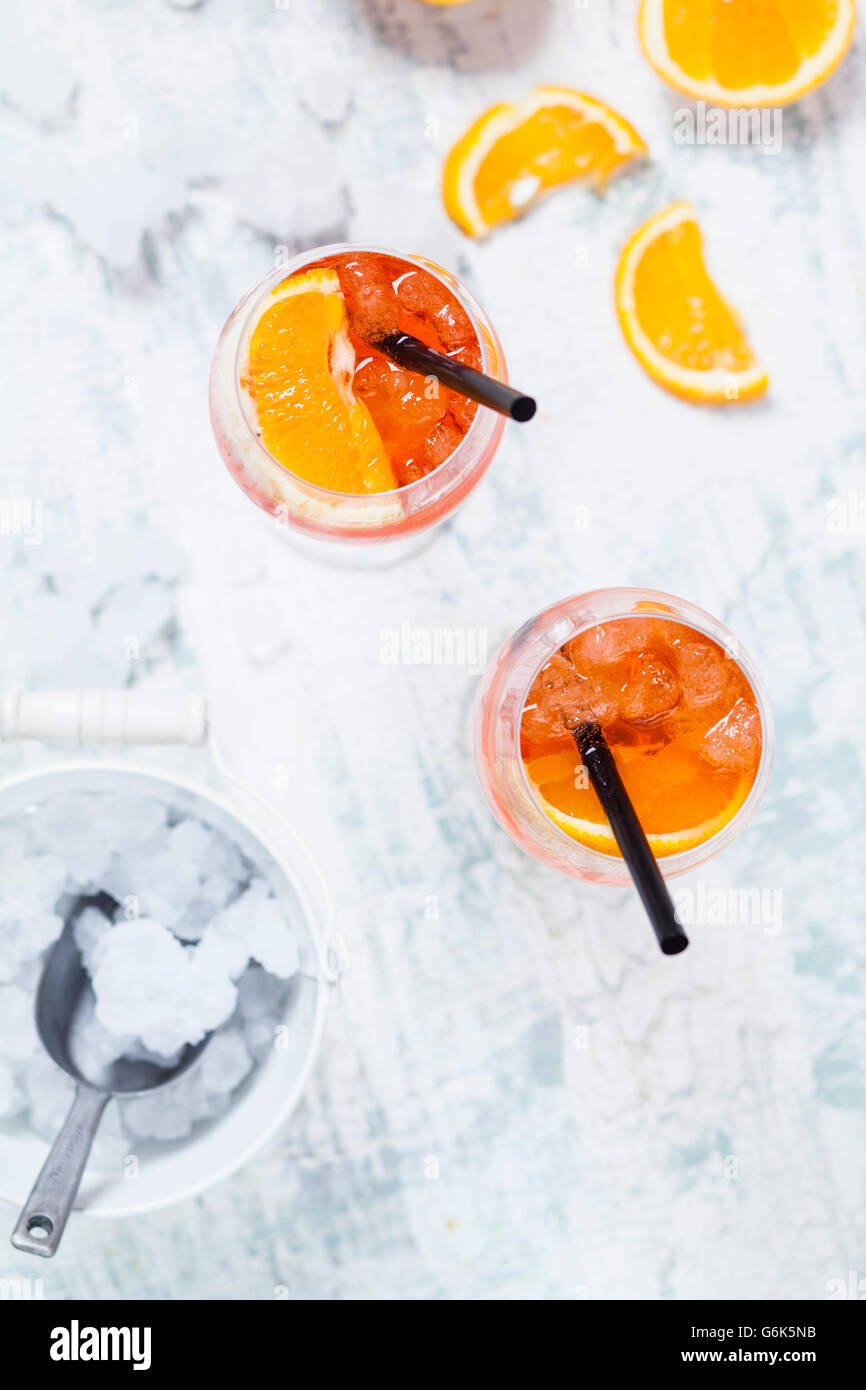 Aperol spritz, bitter liqueur, prosecco wine, sparkling mineral water and orange slice Stock Photo