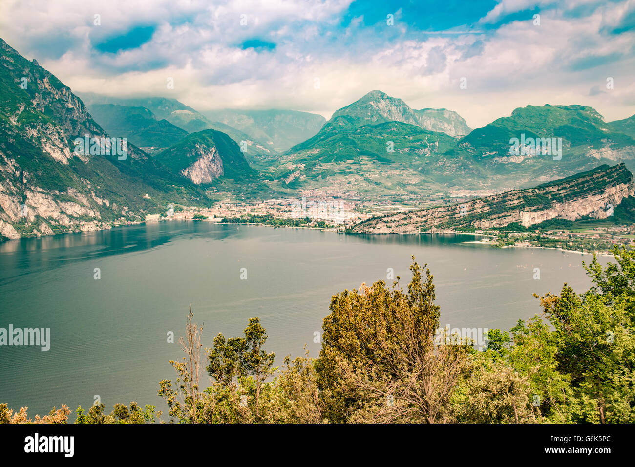 Panorama of the gorgeous Lake Garda surrounded by mountains in Torbole, Italy. Stock Photo