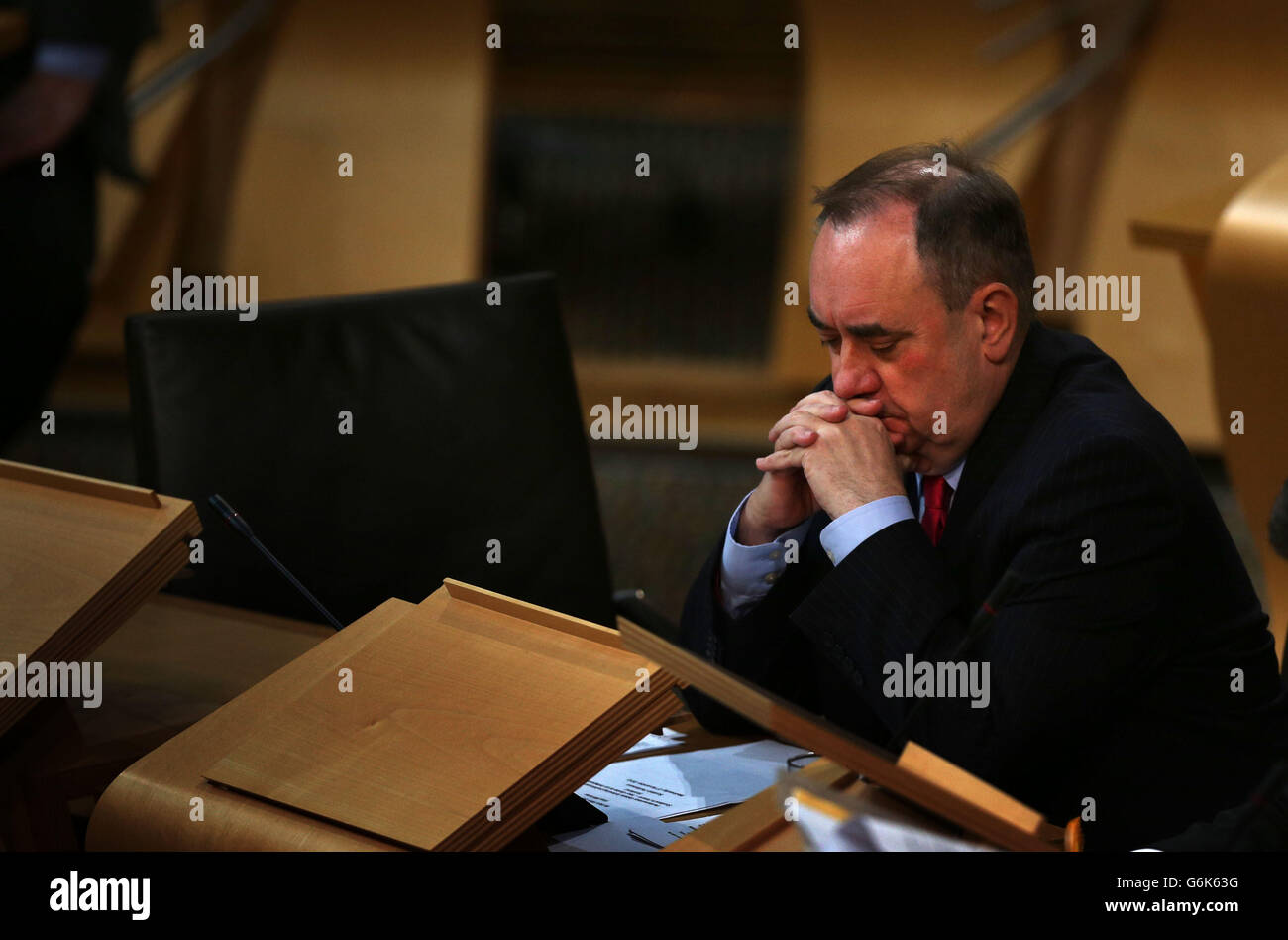 Scottish First Minister Alex Salmond, listens to questions during the Independence debate at the Scottish Parliament, Edinburgh. Stock Photo
