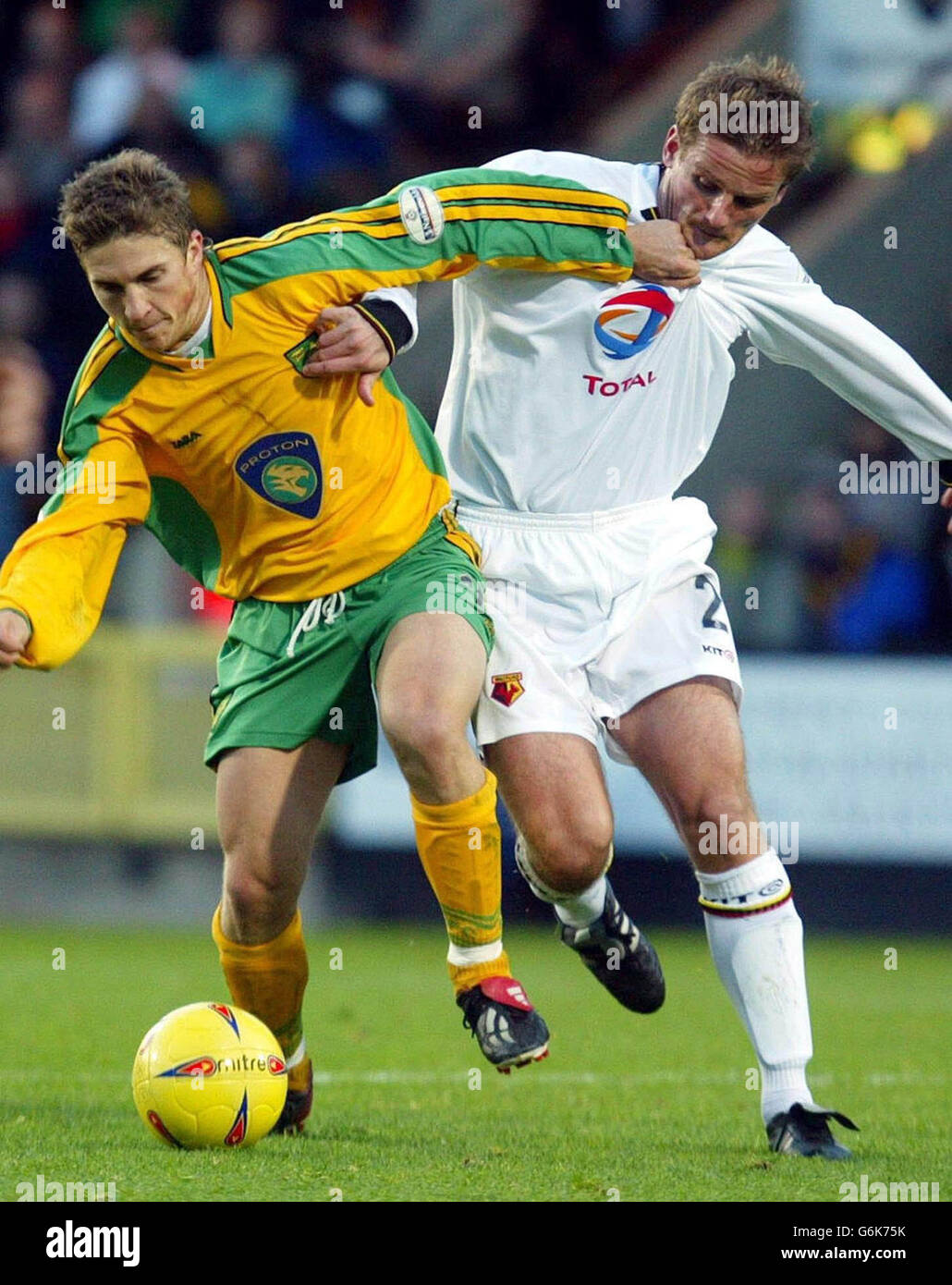 Paul McVeigh of Norwich (left) fights off Watford's Neal Ardley, during the Nationwide Division One match at Carrow Road, Norwich, . Stock Photo
