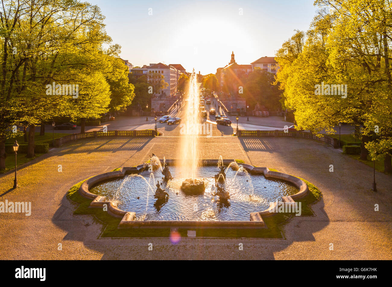 Germany, Munich, Prinzregent-Luitpold-Terrasse with fountain at backlight Stock Photo