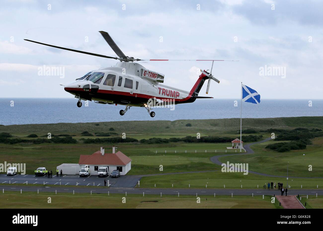 US presidential hopeful Donald Trump lands by helicopter at his revamped Trump Turnberry golf
