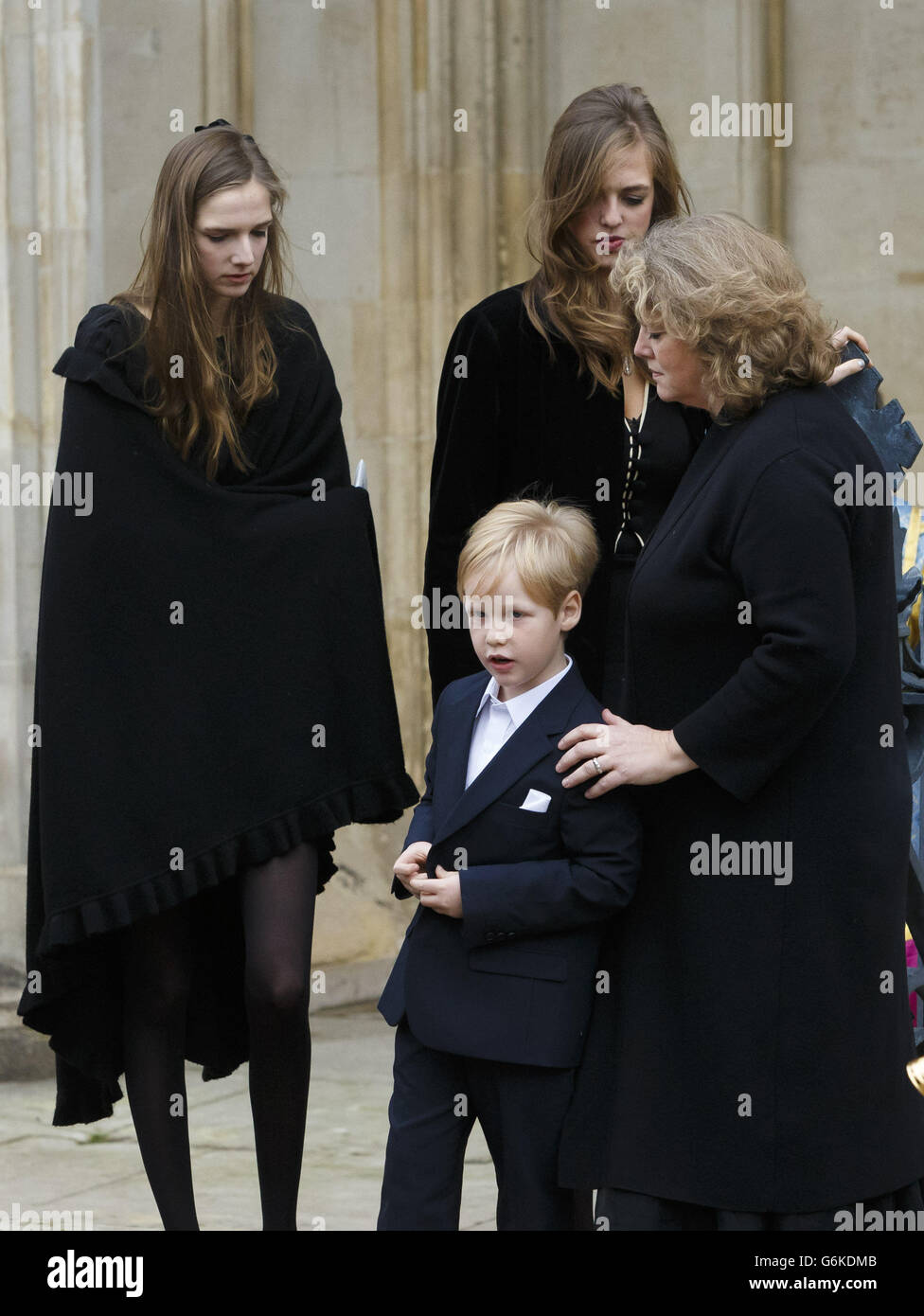 The family of Sir John Tavener (left to right) daughters Sofia and Theodora, widow Maryanna and son Orlando following his funeral at Winchester Cathedral in Hampshire. Stock Photo