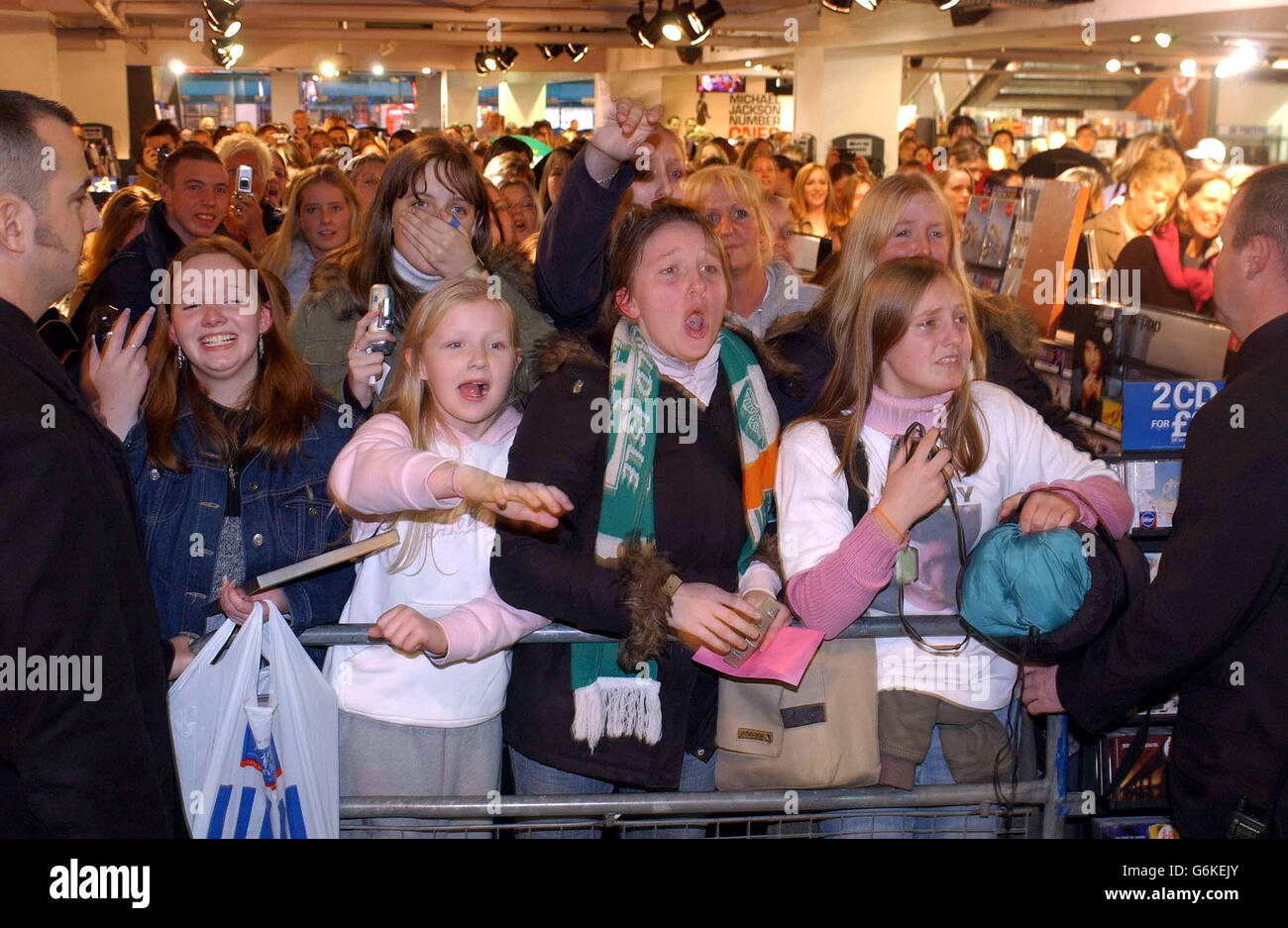 Fans of Westlife scream and cheers as the boyband appear during a photocall and record signing to launch their new single 'Mandy', which is released today, at HMV Trocadero, Piccadilly Circus, central London. Mandy was originally a hit for Barry Manilow back in 1975. Stock Photo
