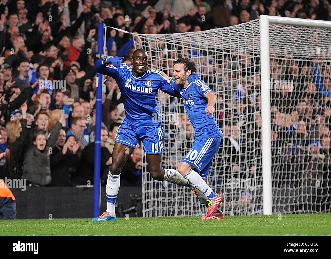 Chelsea's Demba Ba (left) celebrates with his team-mate Juan Mata (right) after scoring his team's third goal Stock Photo