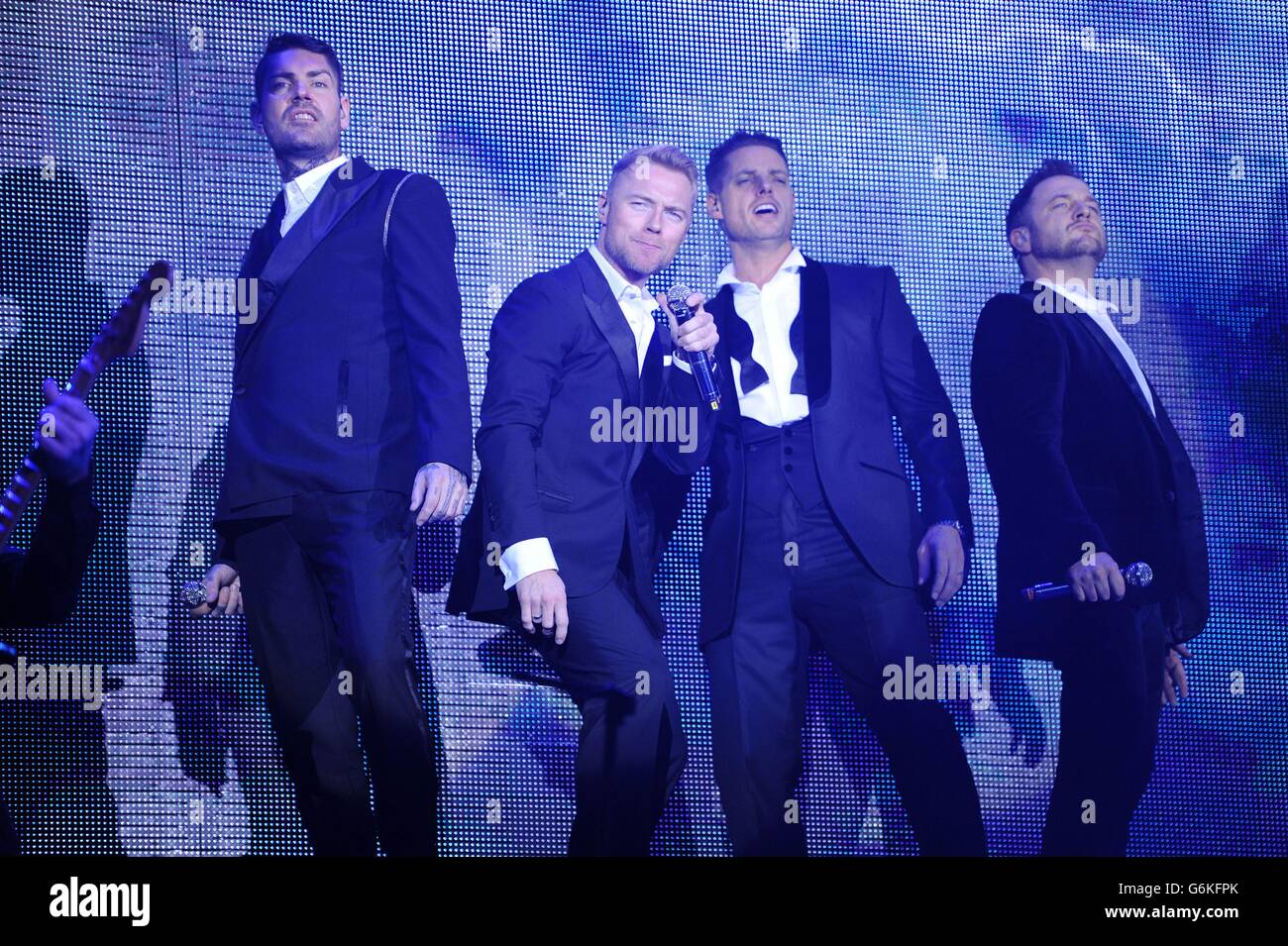 Boyzone (left to right) Shane Lynch, Ronan Keating, Keith Duffy and Mikey Graham of Boyzone perform at the Motorpoint Arena, Cardiff, for the Boyzone 20th anniversary tour. Stock Photo