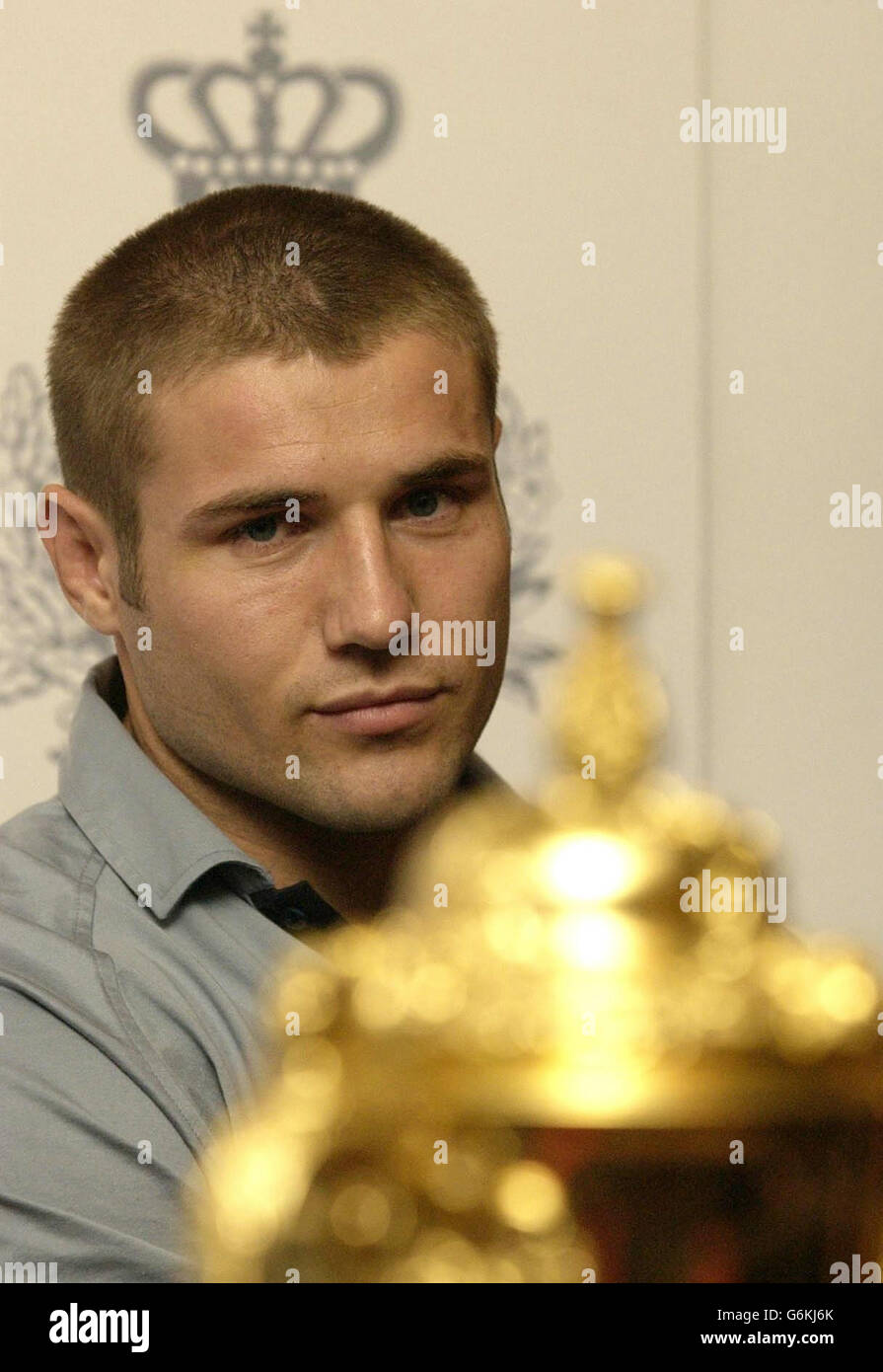 England hero Ben Cohen stares at the William Webb Ellis trophy at the Penny Hill Park Hotel near Bagshot, after the England rugby team returned from Sydney. * Earlier, thousands of people were at Heathrow Airport to welcome home the team that beat Australia in extra time to win the World Cup. Stock Photo