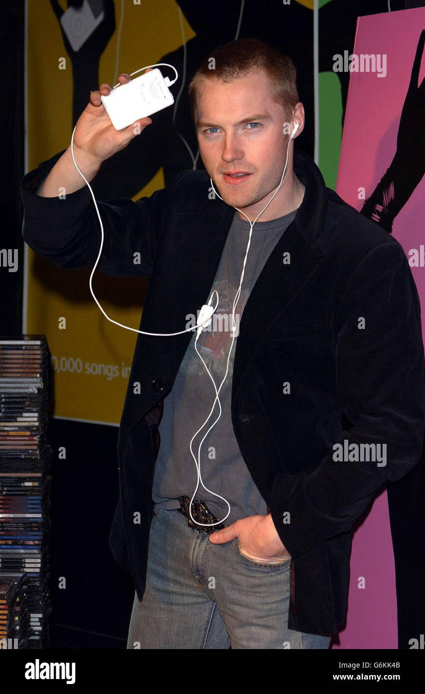 Singer Ronan Keating with the new 40GB Apple iPod which holds 10,000 songs at Virgin Megastore in London's Oxford Street. Ronan switched on the iPod which will play in the store continuously for 28 days until 24th Decmeber 2003. Stock Photo