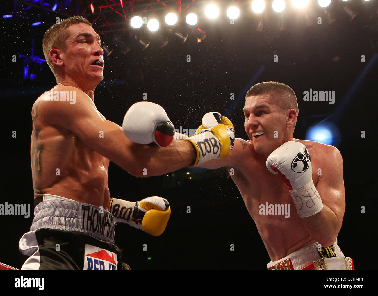 Liam Smith (right) and Mark Thompson during The British Light-middleweight Championship bout at the Echo Arena, Liverpool. Stock Photo