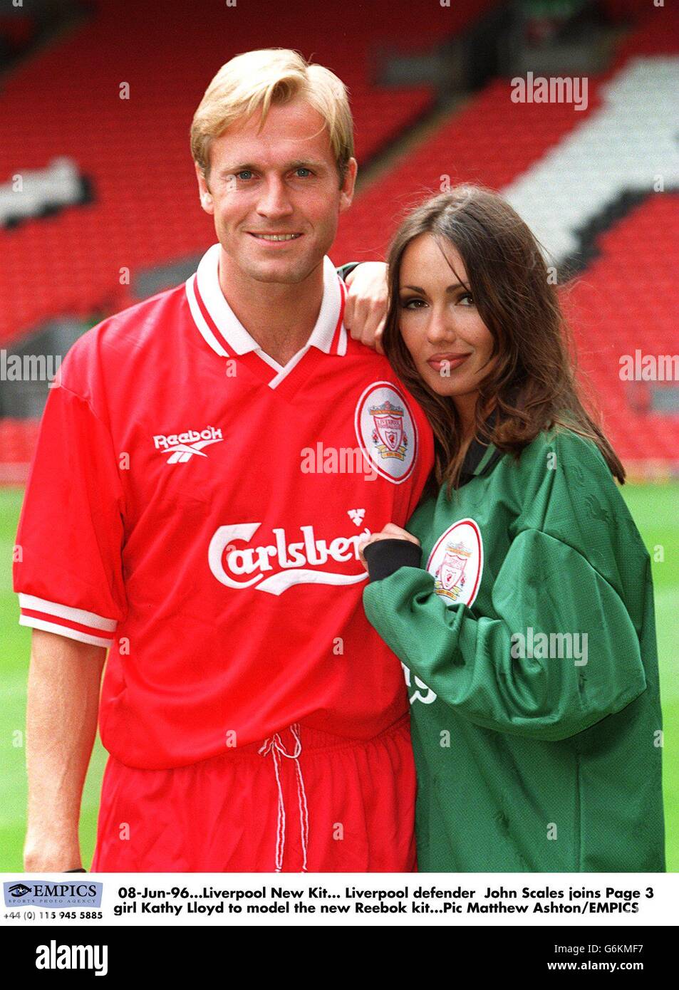 08-Jun-96. Liverpool New Kit. Liverpool defender John Scales joins Page 3 girl Kathy Lloyd to model the new Reebok kit Stock Photo
