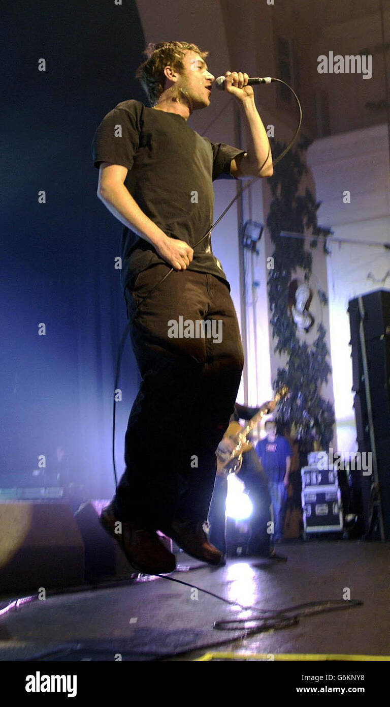 Damon Albarn Blur Gig. Lead Singer Damon Albarn from Blur performs live on stage at the Brixton Academy in south east London. Stock Photo