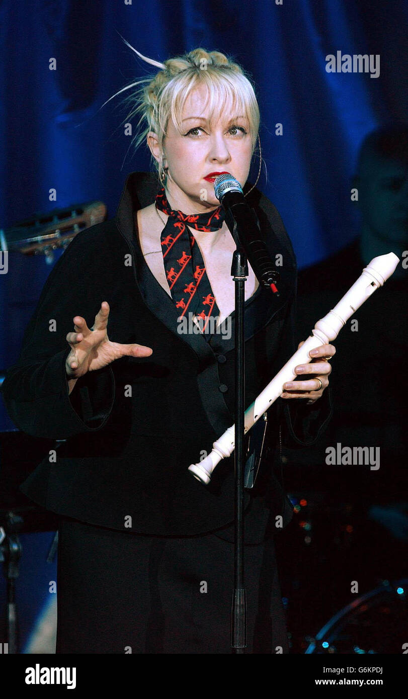 Singer Cyndi Lauper performs songs during a showcase for her latest album 'At Last' at Cafe De Paris in central London. The album - a collection of standards was released Monday 1 December 2003 and includes duets with Tony Bennett and Stevie Wonder. Stock Photo