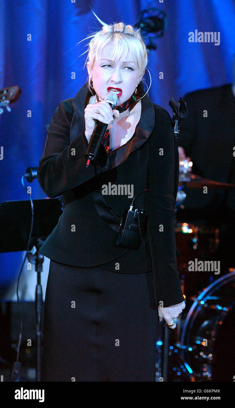 Singer Cyndi Lauper performs songs during a showcase for her latest album 'At Last' at Cafe De Paris in central London. The album - a collection of standards was released Monday 1 December 2003 and includes duets with Tony Bennett and Stevie Wonder. Stock Photo
