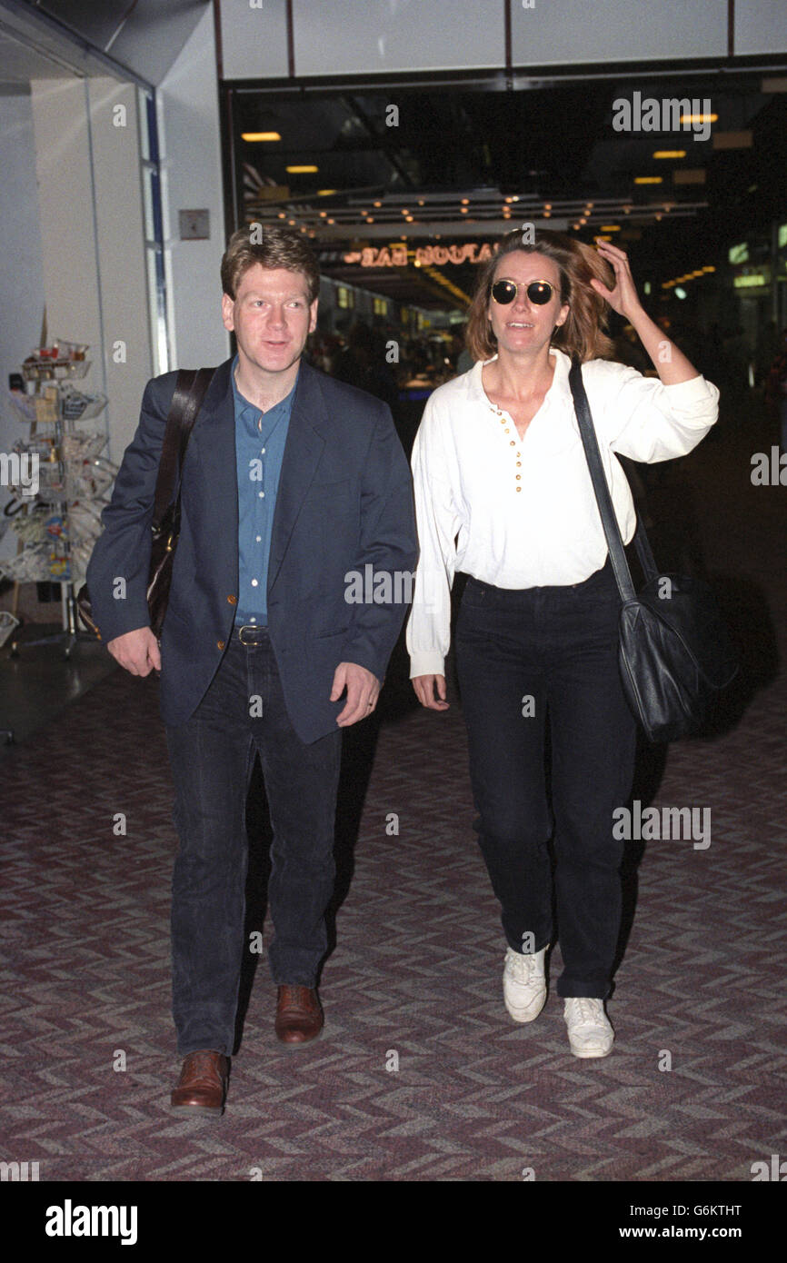 Actor Kenneth Branagh and his actress wife Emma Thompson at Heathrow Airport before departing for Los Angeles. Stock Photo
