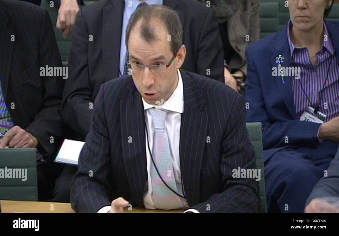 Richard Threlfall, UK Head of Infrastructure, Buildings and Construction, KPMG answers questions in front of the Transport Select Committee at the House of Commons, central London on a contested report predicting the HS2 rail project could benefit the UK by £15 billion a year. Stock Photo