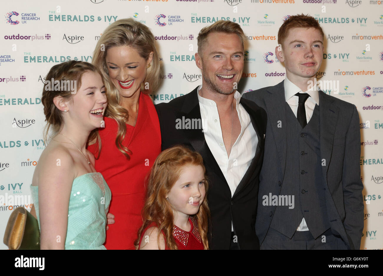 Host Ronan Keating and girlfriend Storm Uechtritz, with his three children from his previous marriage to Yvonne Connolly, Missy (left), Ali and Jack attending the Emeralds and Ivy Ball - which raises funds for Cancer Research UK and the Marie Keating Foundation - at Old Billingsgate in London. Stock Photo