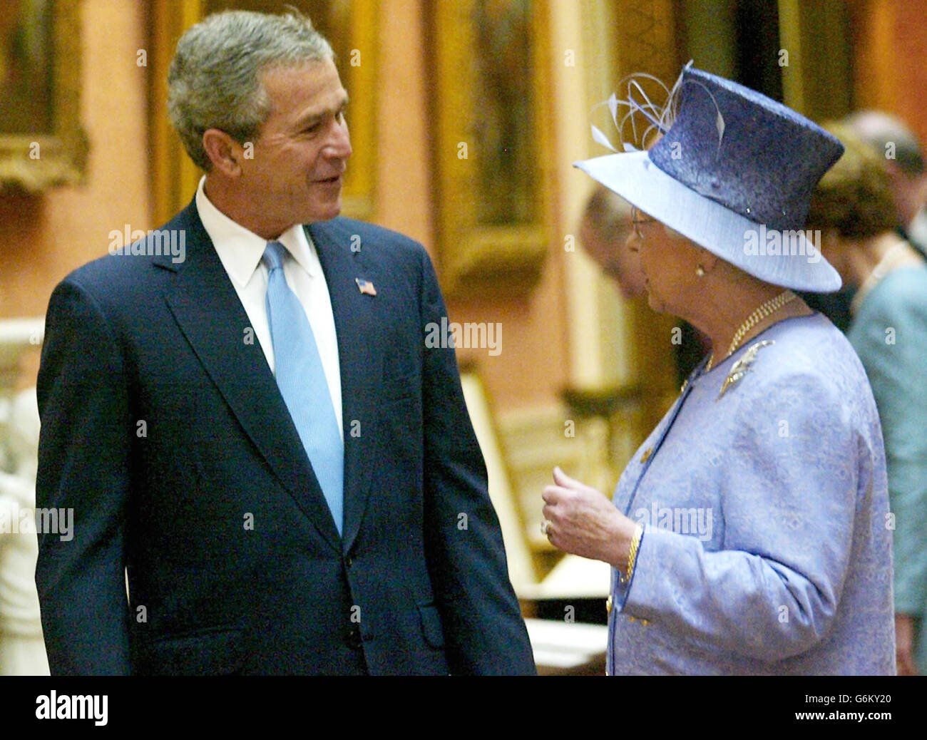 Queen Elizabeth II accompanies America's President George Bush as they enter the Queen's Gallery at Buckingham Palace, at the start of the President's state visit to Britain. Later, Mr Bush was going on to make a speech at the Banqueting Hall in Whitehall and visit the US Embassy. Stock Photo