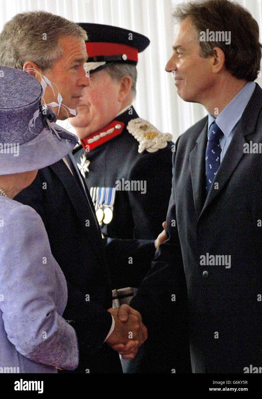 US President George W Bush meets Prime Minister Tony Blair (right) with Britain's Queen Elizabeth II (left) at Buckingham Palace, London. A massive security operation is in place in the capital for the state visit of America's President Bush, who is staying at the Palace as a guest of The Queen. Stock Photo