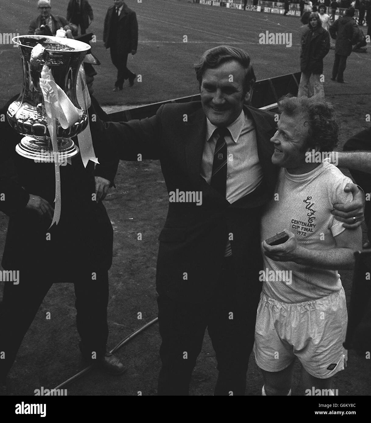 Manager Don Revie and Billy Bremner are overjoyed as they hold the coveted FA Cup, after their team's victory over Arsenal. Stock Photo