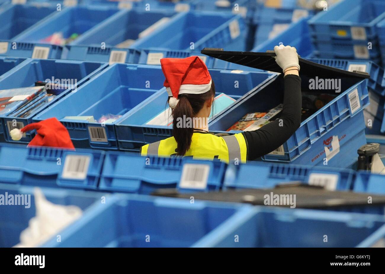 Workers prepare orders for delivery at the Argos distribution centre