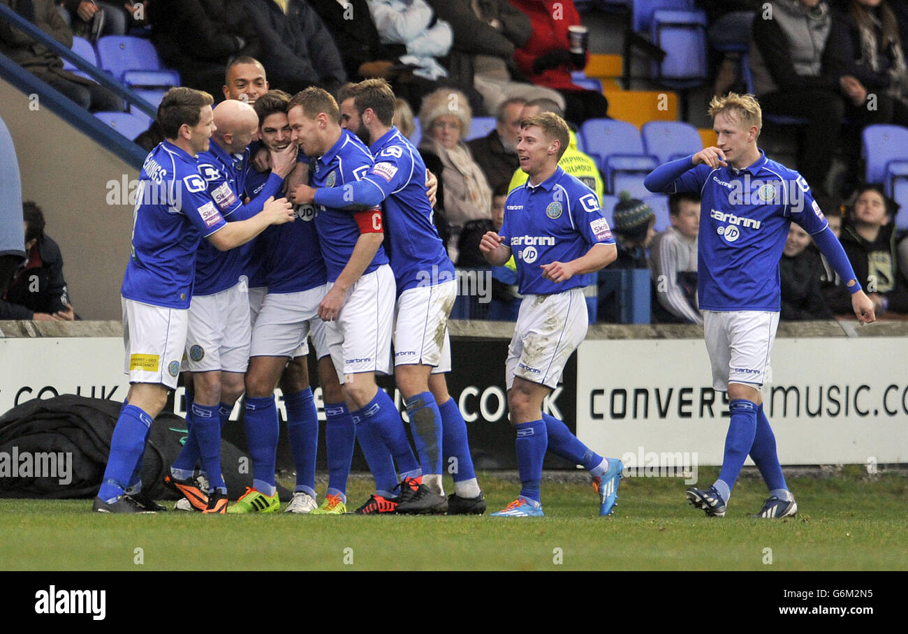 Macclesfield Town's Danny Andrew (third left) celebrates with his team-mates after he scores the first goal of the game during the FA Cup match at Moss Rose, Macclesfield. Stock Photo