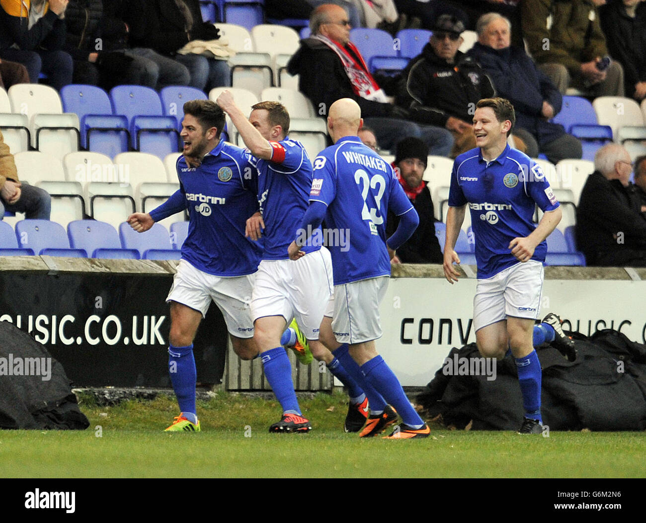 Macclesfield Town's Danny Andrew (left) celebrates after he scores the first goal of the game during the FA Cup match at Moss Rose, Macclesfield. Stock Photo