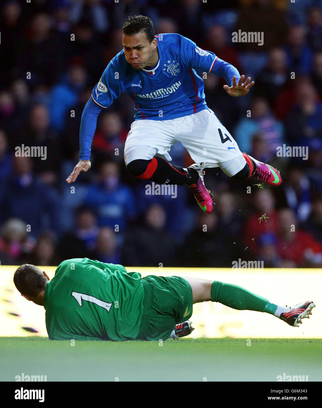 Soccer - Scottish League One - Rangers v Ayr - Ibrox Stadium. Rangers Arnold Peralta jumps over Ayr's David Hutton during the Scottish League One match at Ibrox Stadium, Glasgow. Stock Photo