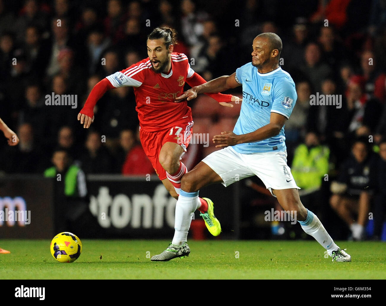 Southampton's Pablo Daniel Osvaldo (left) and Manchester City's Vincent Kompany battle for the ball Stock Photo