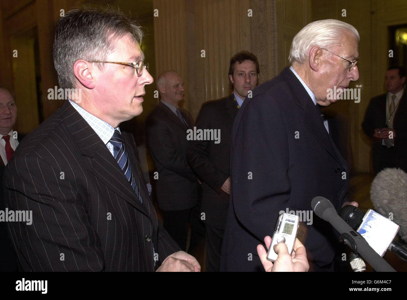 Democratic Unionist leader, Ian Paisley (right) and deputy leader, Peter Robinson, speaking to journalists before a party meeting with the Secretary of State for Northern Ireland, Paul Murphy. Robinson, whose party emerged the largest grouping in the Assembly after last Wednesday's election, queried whether the Government would be willing to force MLAs to go to the polls again in the event of a political stalemate. Stock Photo
