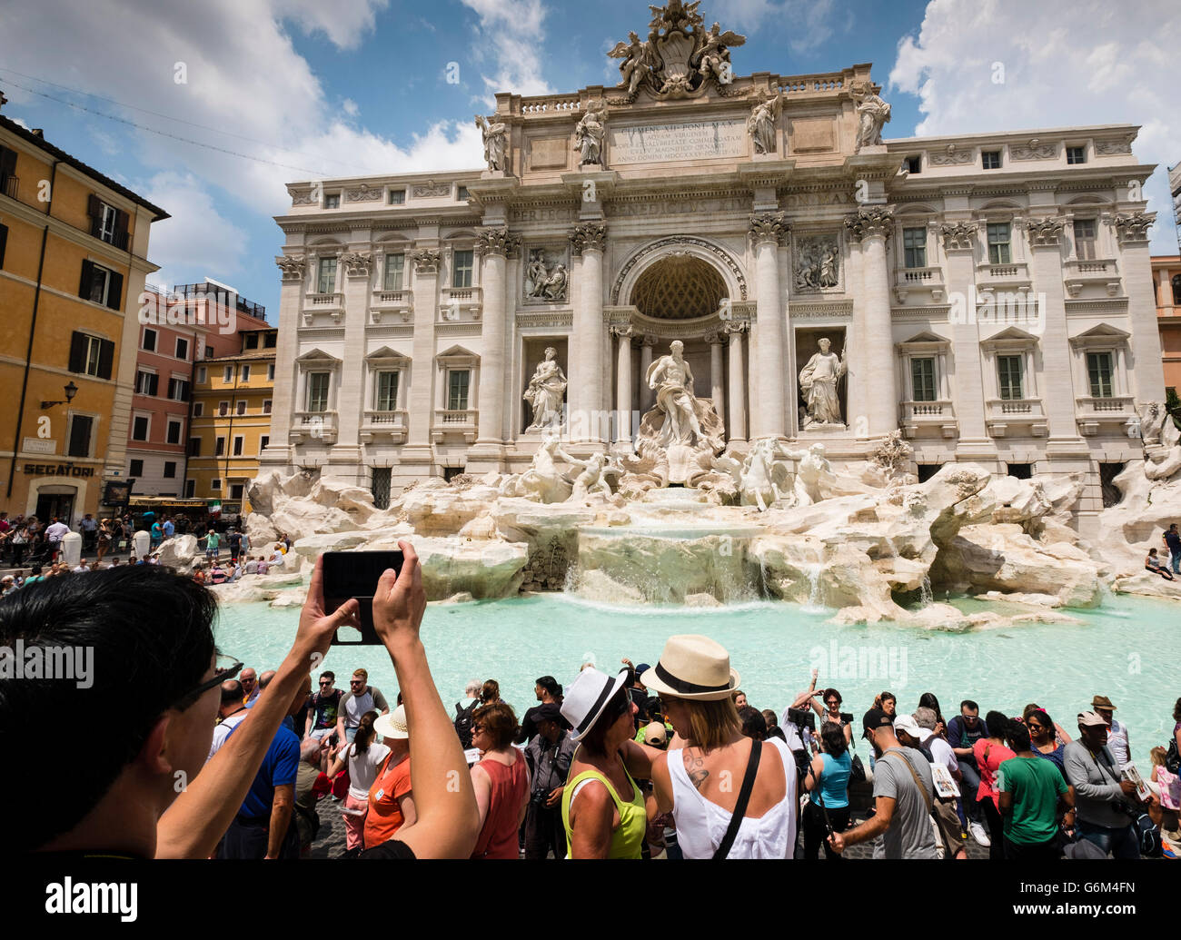 Trevi Fountain or Fontana di Trevia with many tourists in Rome Italy Stock Photo