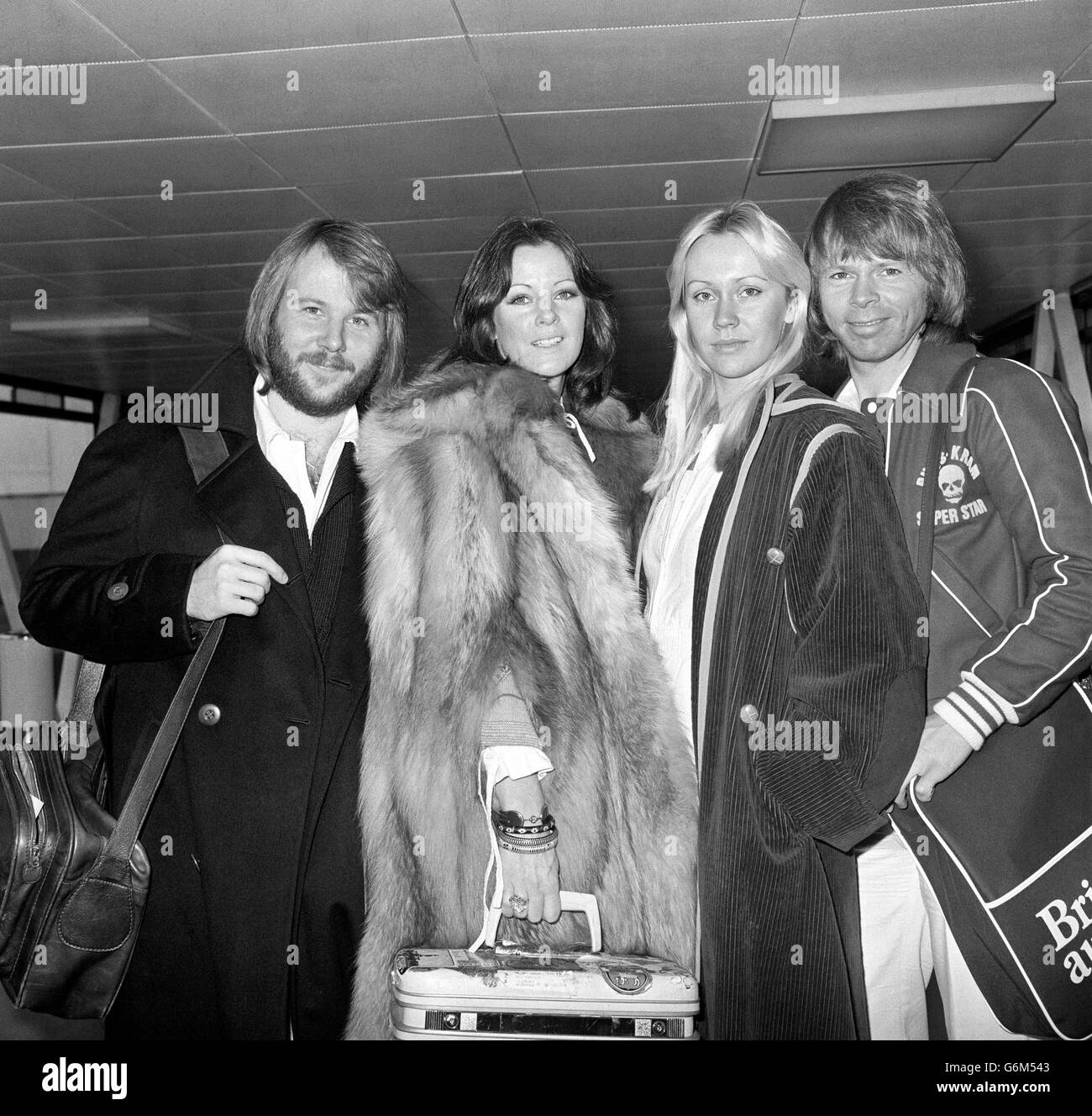 Swedish pop group ABBA (from left) Benny Andersson, Annifrid Lyngatad, Agnetha Faltskog and Bjorn Ulvaeus at Heathrow Airport. Stock Photo