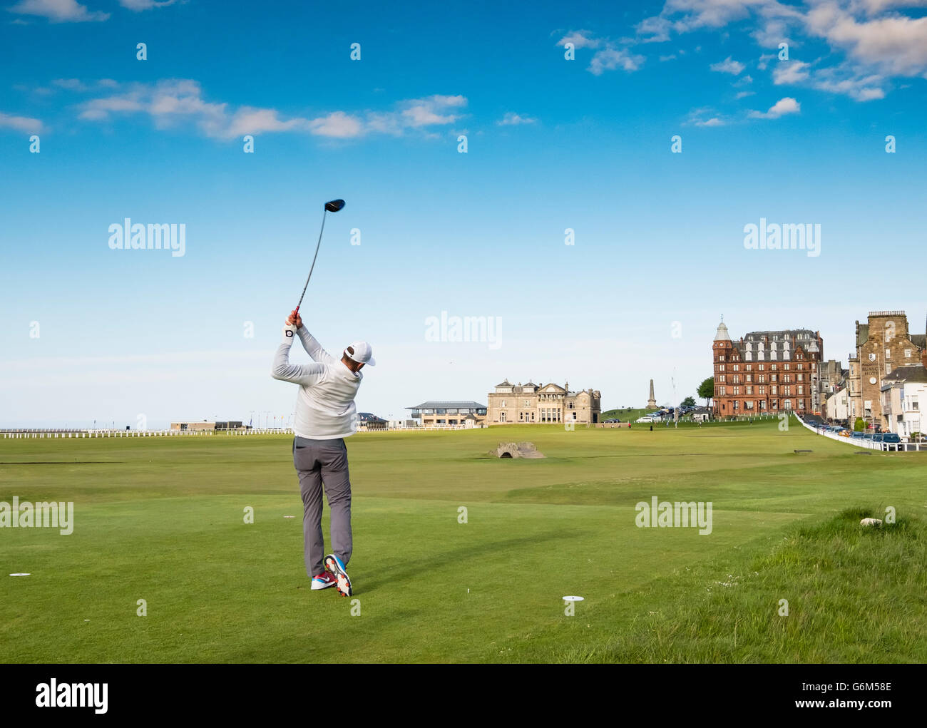 Golfer teeing off on 18th hole at Old Course in St Andrews in Fife , Scotland, United Kingdom Stock Photo