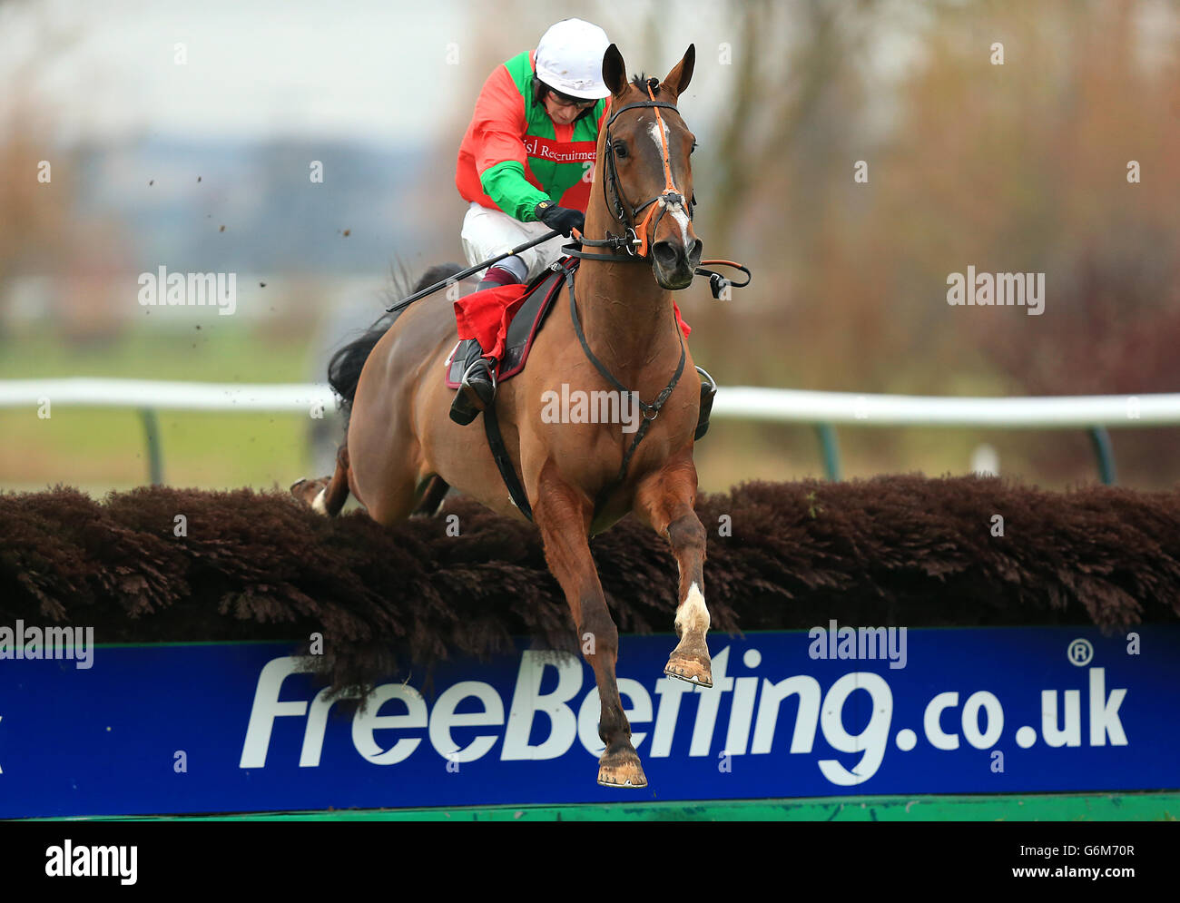 Horse Racing Southwell Racecourse. Jockey James Best on Hurricane Ivan jumps a hedge during