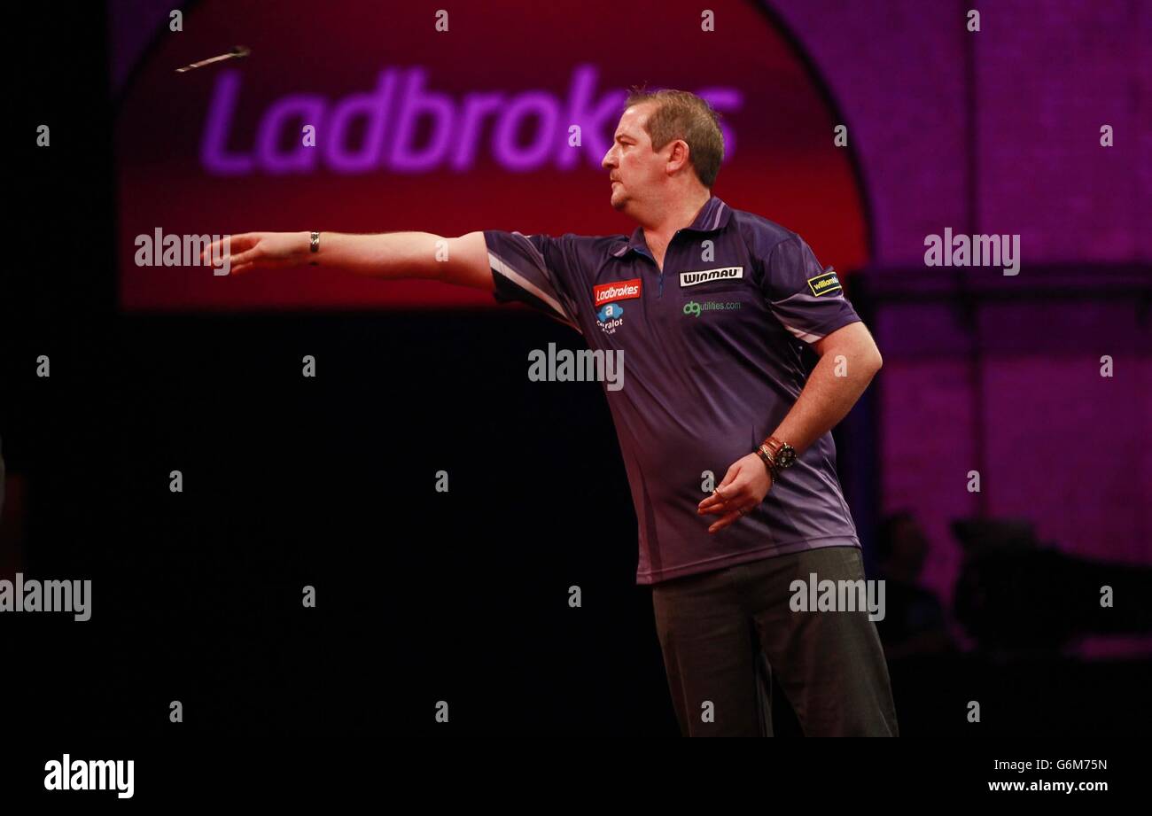 Dean Winstanley in action during day one of The Ladbrokes World Darts Championship at Alexandria Palace, London. Stock Photo